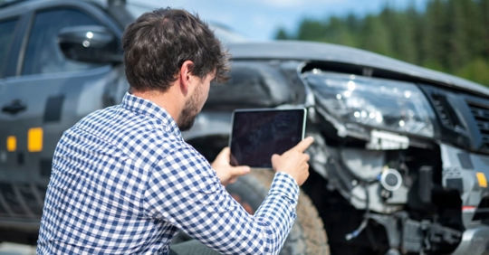 person taking photos of car accident